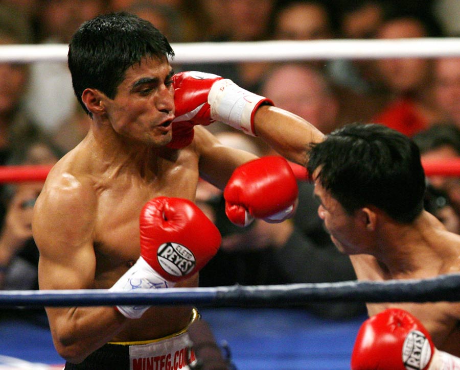 Erik Morales takes a punch from Manny Pacquiao