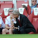 Arsene Wenger watches nervously on the bench
