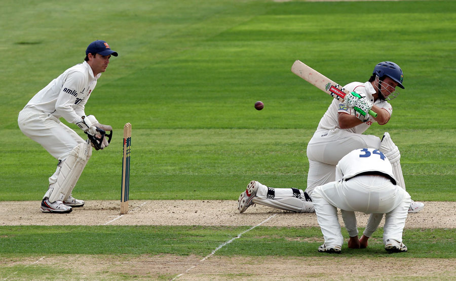 Gareth Rees sweeps a delivery