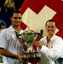 Roger Federer and Martina Hingis celebrate their victory