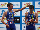 Alistair Brownlee pours champagne on his brother Jonathan