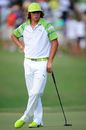 Rickie Fowler leans on his putter