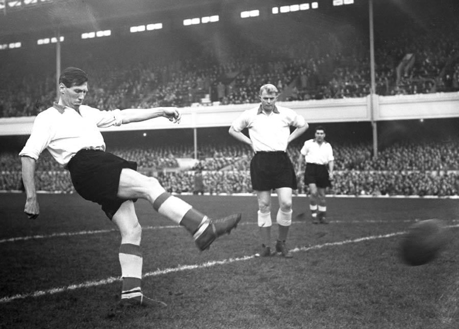 Len Shackleton hits a volley