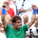 Rafael Nadal raises his arms in triumph