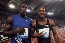 Asafa Powell poses with Usain Bolt