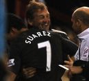 Kenny Dalglish laughs with Luis Suarez
