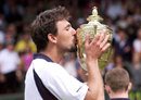 Goran Ivanisevic kisses his trophy