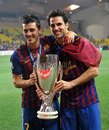 Cesc Fabregas and David Villa show off Barcelona's new trophy