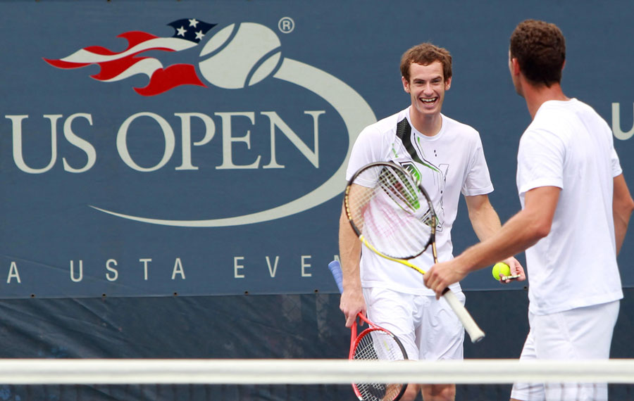 Andy Murray shares a joke with Michael Llodra