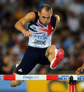 Dai Greene measures a hurdle in the 400m hurdles