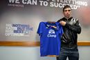 Denis Stracqualursi poses with an Everton shirt