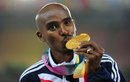 Mo Farah kisses his gold medal
