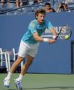Juan Carlos Ferrero stretches for a backhand