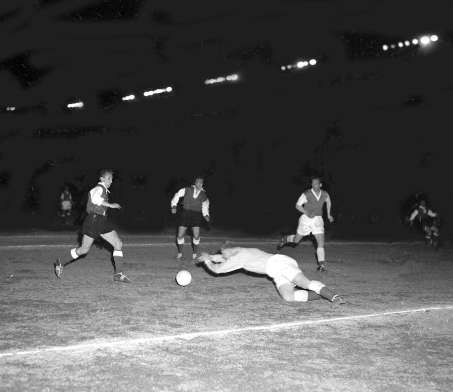 Tommy Younger dives on the ball