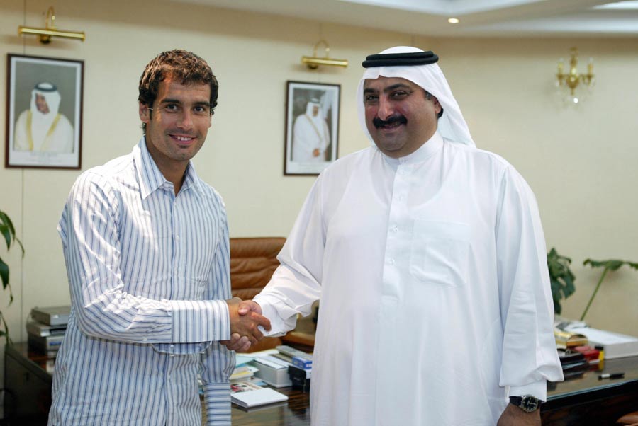 Pep Guardiola shakes hands with Sheik Khaled bin Ali al-Thani