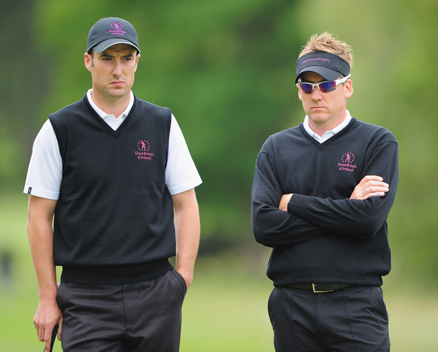 Ross Fisher and Ian Poulter wait