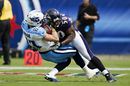 Albert McClellan of the Baltimore Ravens tackles Marc Mariani of the Tennessee Titans 