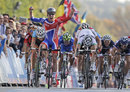 A triumphant Mark Cavendish crosses the line