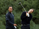 Jamie Redknapp watches his drive as Ruud Gullit looks on