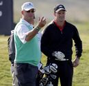 Sandy Lyle chats with playing partner Andrew Strauss