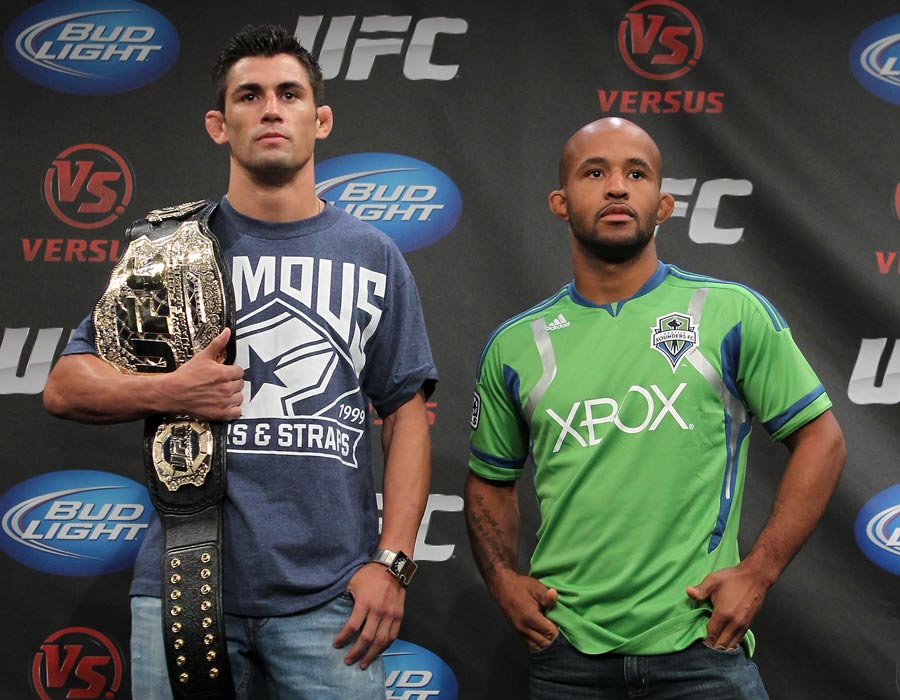 Dominick Cruz and Demetrious Johnson pose at the UFC Live pre-fight press conference