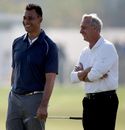 Ruud Gullit and Johan Cruyff laugh on the first green