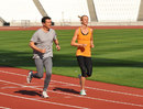 Lord Coe and Hannah England take a practice run on the Olympic track