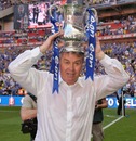Guus Hiddink lifts the trophy after Chelsea's win over Everton in the FA Cup final