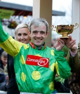 Ruby Walsh celebrates after winning the 2009 Cheltenham Gold Cup aboard Kauto Star