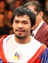 Manny Pacquiao enters the ring ahead of his WBO welterweight title fight with Miguel Cotto