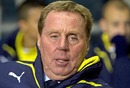 Harry Redknapp takes his place on the Tottenham bench