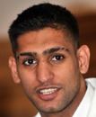 Amir Khan replies to a question during a press conference in Karachi