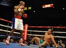Floyd Mayweather Jnr knocks down Juan Manuel Marquez on his way to victory in their welterweight fight