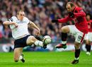 Richard Dunne toes the ball away from Wayne Rooney