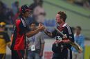 Paul Collingwood is congratulated by captain Alastair Cook