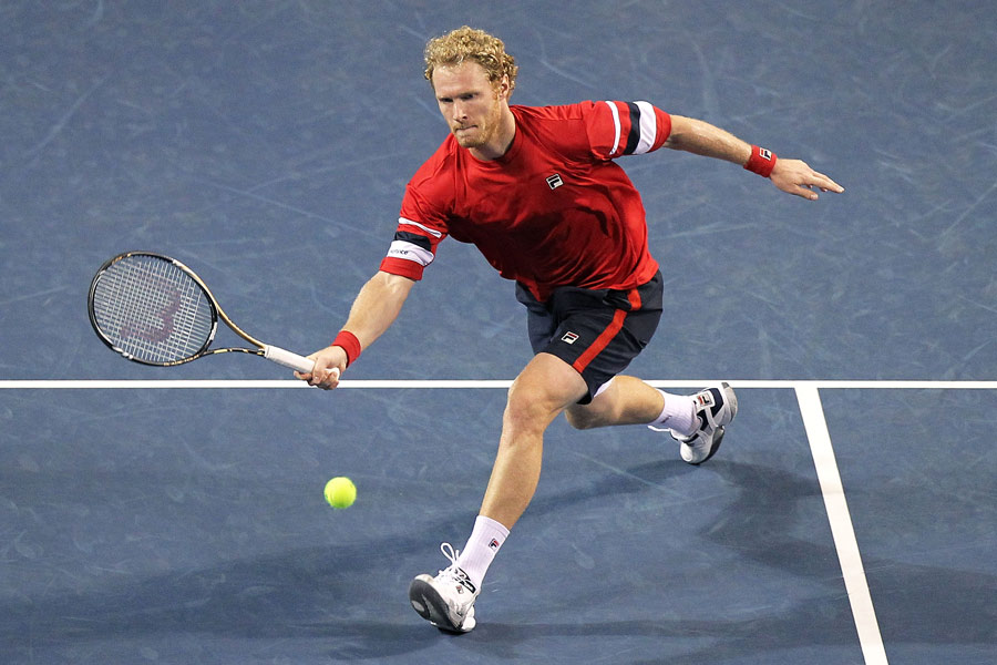 Dmitry Tursunov stretches for a volley