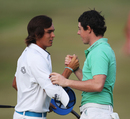 Rickie Fowler and Rory McIlroy shake hands