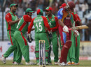 Bangladesh get together after claiming a wicket