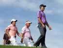Rory McIlroy, Darren Clarke and Charl Schwartzel make their way from the first tee