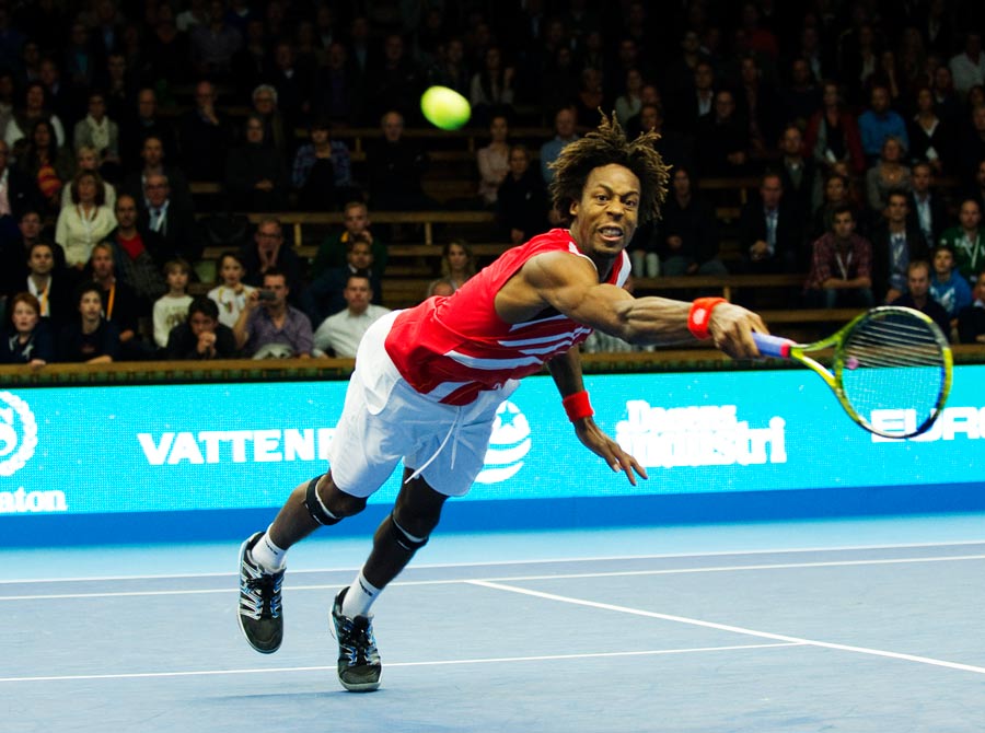Gael Monfils dives to reach a volley