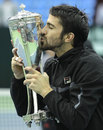 Janko Tipsarevic kisses his trophy