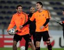 Frank Lampard shares a joke with John Terry during a training session