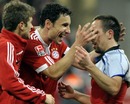 Franck Ribery celebrates with Mark van Bommel and Thomas Mueller