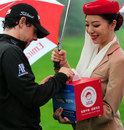 Rory McIlroy makes a donation to charity