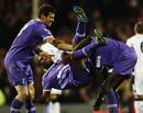Gareth Bale and Emmanuel Adebayor upend Jermain Defoe after his goal
