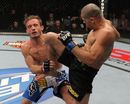 Renan Barao delivers a knee strike against Brad Pickett