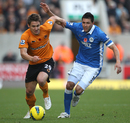 Kevin Doyle tussles with Antolin Alcaraz