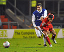 Andreas Mancini of Oldham battles for the ball with Ashley Westwood