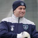 Shay Given puts on his glvoes during a training session