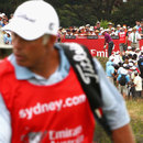 Tiger Woods tees off with Steve Williams in the foreground